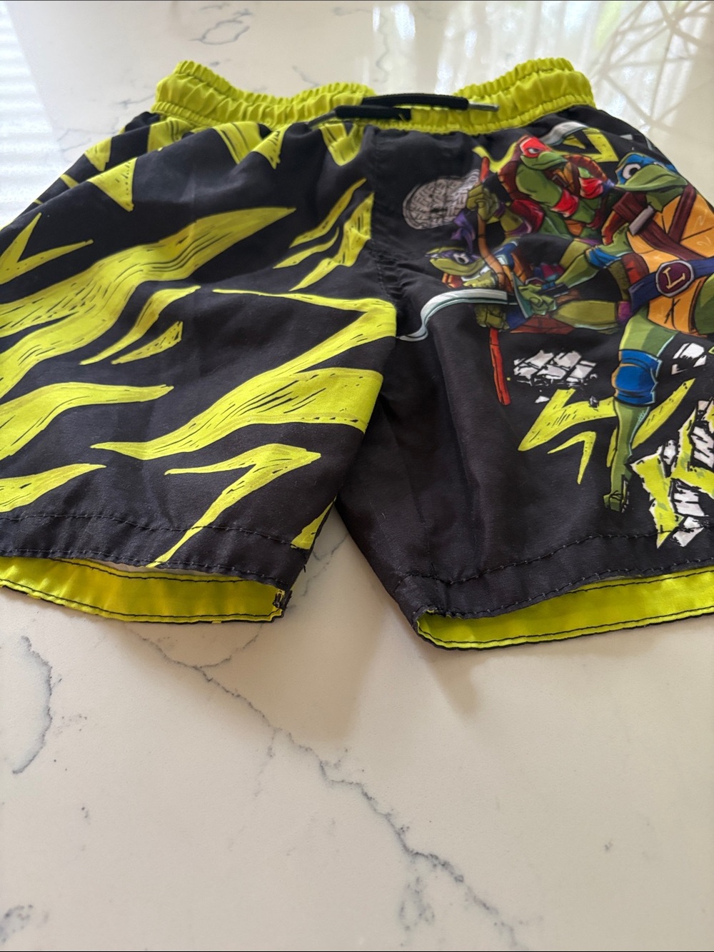 Kids' Neon Yellow and Black Swim Trunks with Turtle Graphic